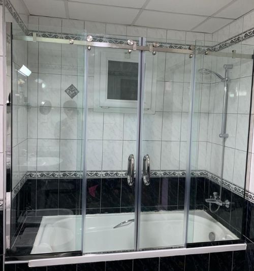 Shower glass partition installation in Dubai bathroom