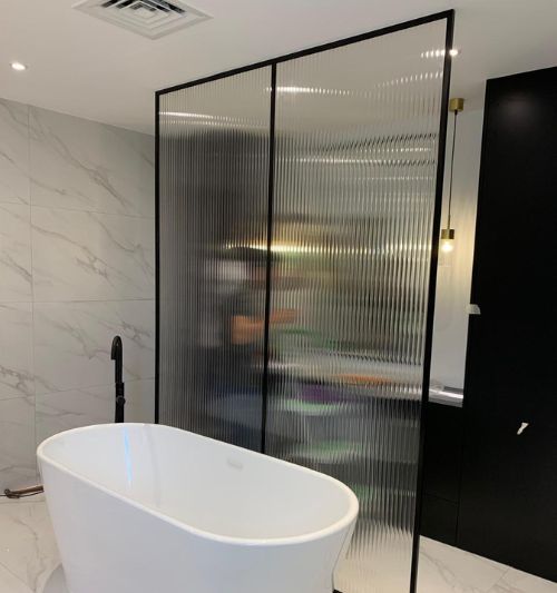 Shower glass partition installation in Dubai bathroom